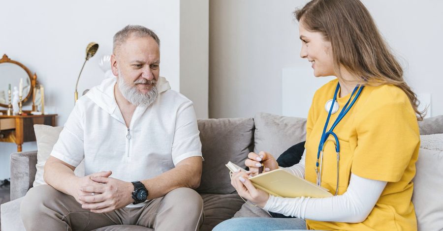 A clinician talking with a patient